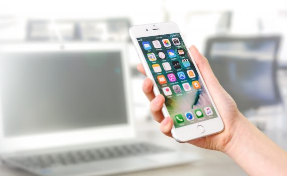 Person holding silver iphone 7
